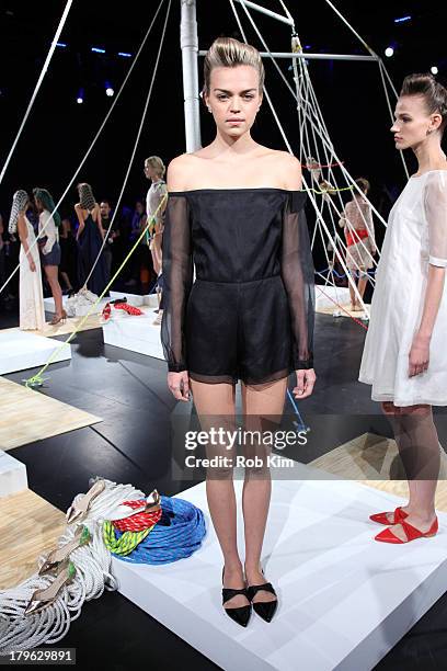 Models pose at the Candela presentation during Spring 2014 Mercedes-Benz Fashion Week at The Box at Lincoln Center on September 5, 2013 in New York...