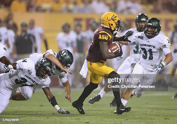 Defensive back Robert Nelson of the Arizona State Sun Devils returns a punt against the Sacramento State Hornets during the college football game at...