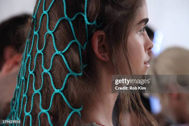 Models backstage at hair and makeup at the Candela presentation during Spring 2014 Mercedes-Benz Fashion Week at The Box at Lincoln Center on...