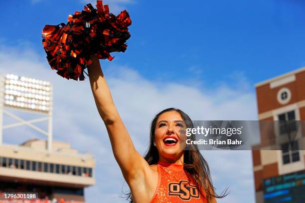 An Oklahoma State Cowboys pom squad member cheers before a Bedlam game against the Oklahoma Sooners at Boone Pickens Stadium on November 4, 2023 in...