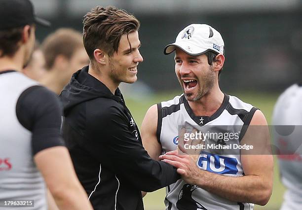 Paul Seedsman and Alan Didak react during a Collingwood Magpies AFL training session at Olympic Park on September 6, 2013 in Melbourne, Australia.