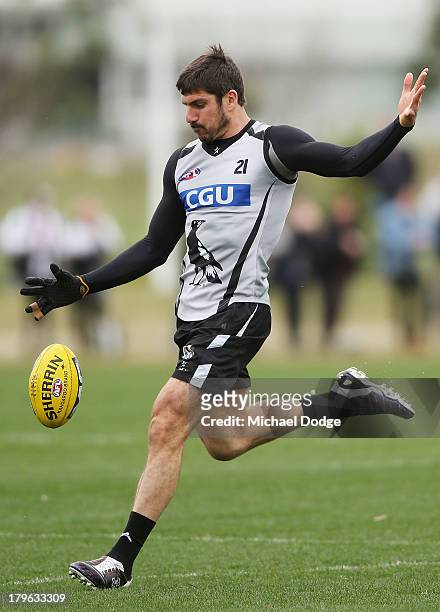 Quinten Lynch kicks the ball during a Collingwood Magpies AFL training session at Olympic Park on September 6, 2013 in Melbourne, Australia.