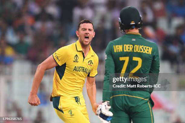 Josh Hazlewood of Australia celebrates after dismissing Rassie van der Dussen of South Africa during the ICC Men's Cricket World Cup India 2023 Semi...