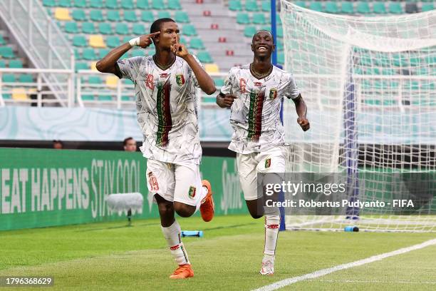 Mahamoud Barry of Mali celebrates with teammate Sekou Kone after scoring the team's second goal during the FIFA U-17 World Cup Group B match between...