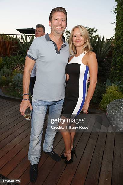 Jason Kosova and Jennifer Kosova attend the Auto Gallery Event at the residences at W Hollywood on September 5, 2013 in Hollywood, California.