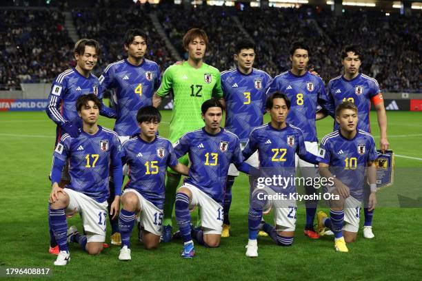 Japan players line up for the team photos prior to the FIFA World Cup Asian 2nd qualifier match between Japan and Myanmar at Panasonic Stadium Suita...