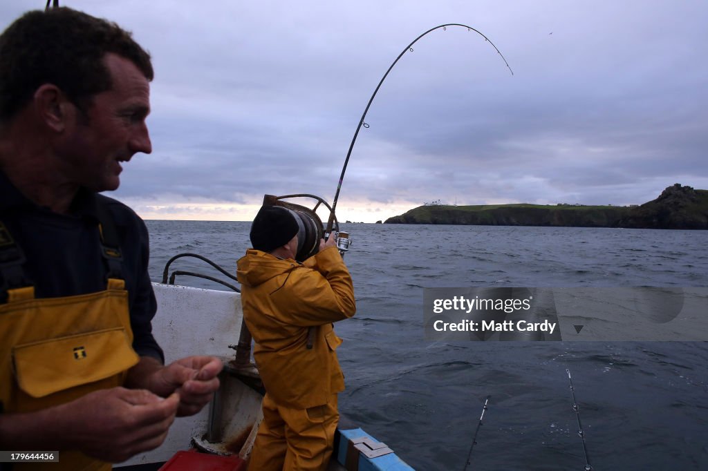Lizard Fishinerman Fisherman Nick Casely fishes for bass close to the Lizard penisula as ...