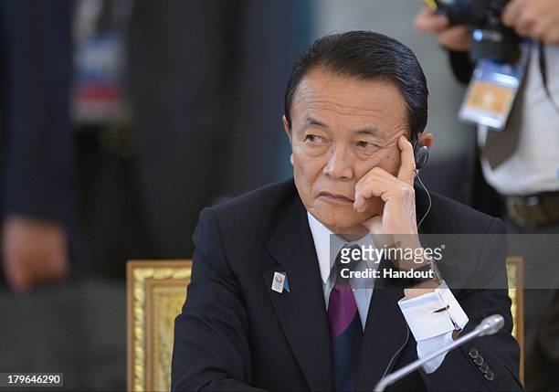 In this handout image provided by Host Photo Agency, Japanese Finance Minister Taro Aso attends the second working meeting of the G20 heads of state...