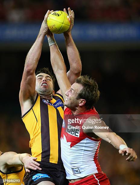 Brian Lake of the Hawks marks infront of Jude Bolton of the Swans during the AFL First Qualifying Final match between the Hawthorn Hawks and the...