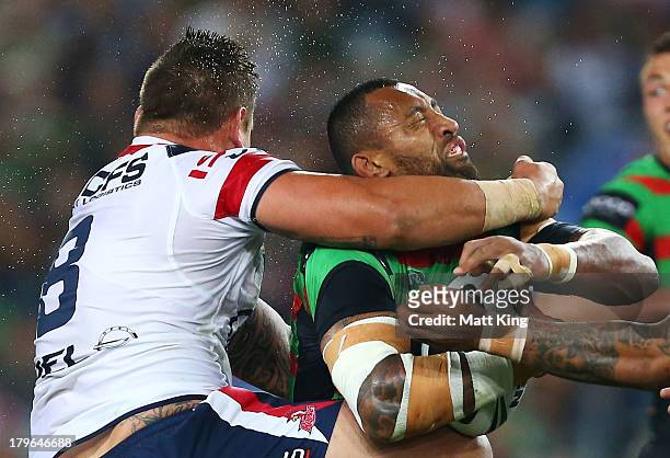 Roy Asotasi of the Rabbitohs is tackled high by Jared Waerea-Hargreaves of the Roosters during the round 26 NRL match between the South Sydney...