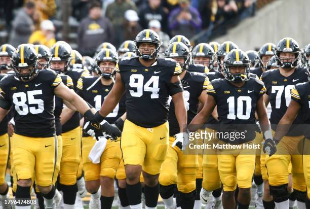 Defensive lineman Yahya Black of the Iowa Hawkeyes takes the field with his teammates bee the match-up against the Rutgers Scarlet Knights at Kinnick...