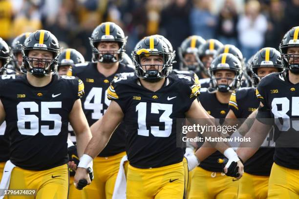 Defensive end Joe Evans of the Iowa Hawkeyes takes the field with his teammates bee the match-up against the Rutgers Scarlet Knights at Kinnick...