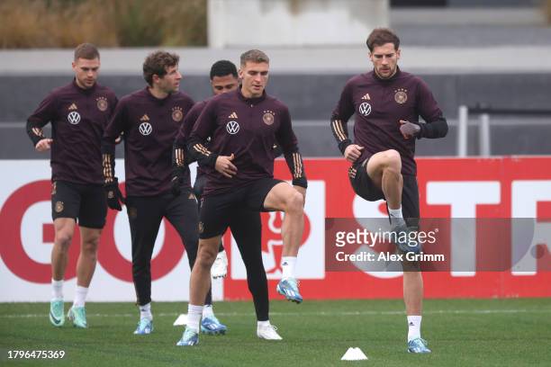 Joshua Kimmich, Thomas Mueller, Serge Gnabry, Grischa Proemel and Leon Goretzka exercise during a training session of the German national football...
