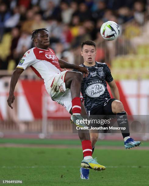 Wilfried Singo of AS Monaco anticipates Axel Camblan of Stade Brestois 29 to the ball during the Ligue 1 Uber Eats match between AS Monaco and Stade...