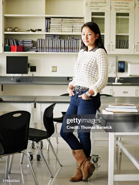 smiling female student in science lab classroom - 2013newwomen stock pictures, royalty-free photos & images