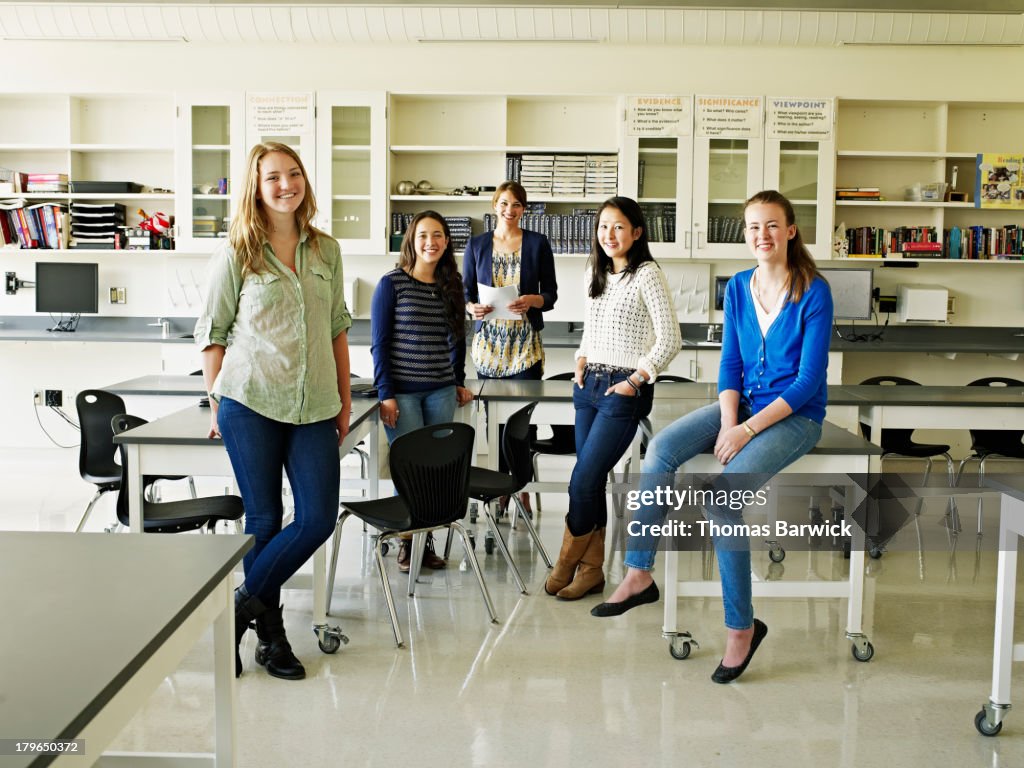 Group of female students and teacher in lab