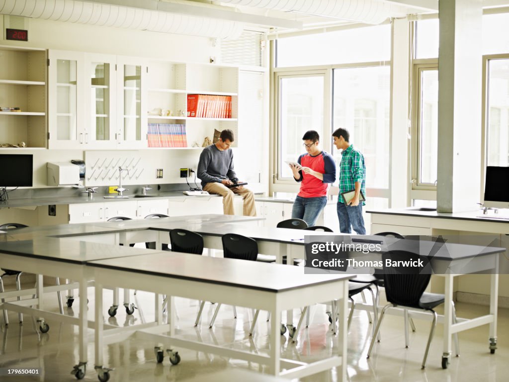 Group of students studying together in classroom