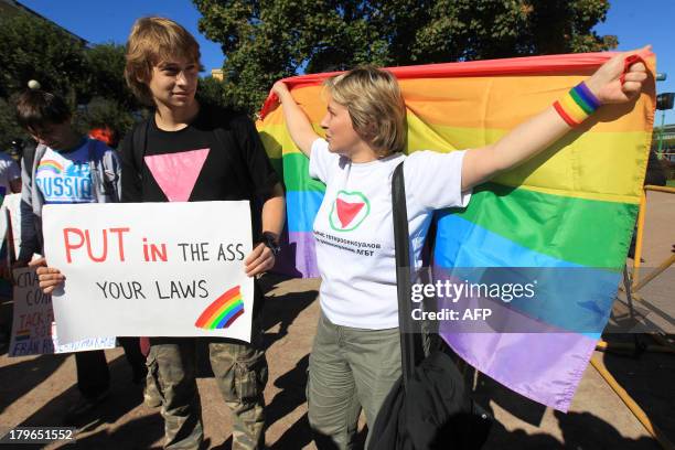 Gay rights activists take part in a gay pride event in Saint Petersburg on September 6, 2013. US President Barack Obama was set toiday to meet...