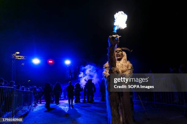 Krampus poses during a Krampus night. Around 600 devilish masks participated in this traditional parade event Krampus night. People dressed as...