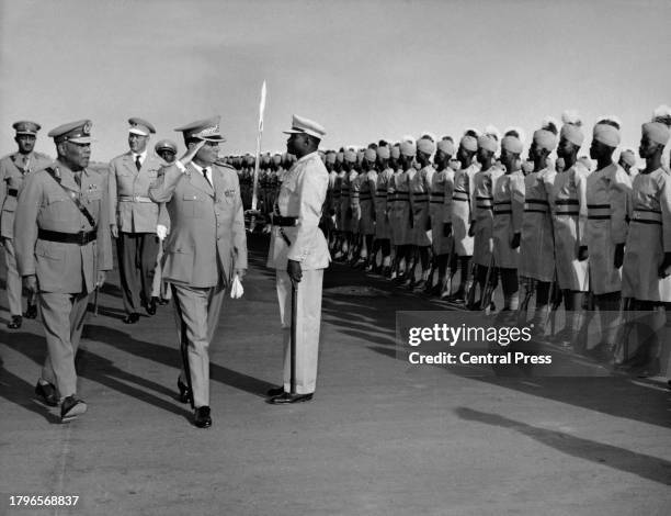 Sudanese politician Ibrahim Abboud, President of Sudan, as Yugoslav politician Josip Broz Tito, President of Yugoslavia, salutes the Guard of Honour...