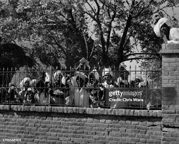 Group of Sudanese schoolboys at the railings of their elementary school in Khartoum, Sudan, circa 1955.