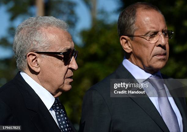 In this handout image provided by Host Photo Agency, Russian Foreign Minster Sergei Lavrov and Lakhdar Brahimi, Joint Special Representative for...