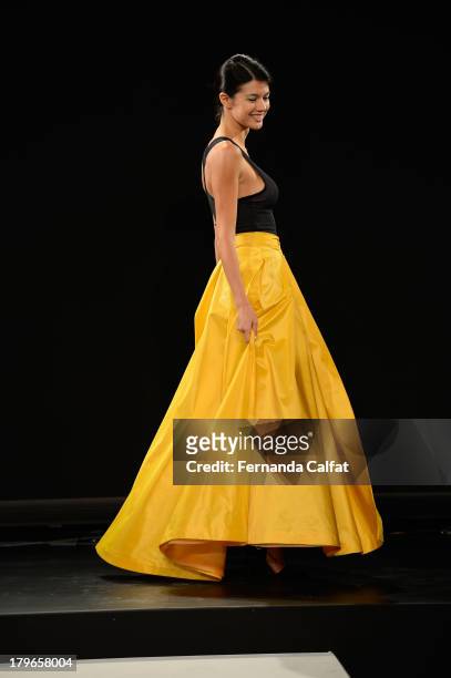 Model poses at the Fashion Law Institute Spring 2014 fashion presentation during Mercedes-Benz Fashion Week at The Box at Lincoln Center on September...