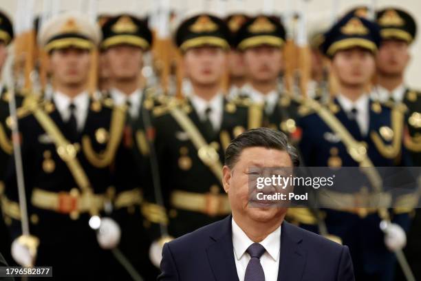 Chinese President Xi Jinping reviews the honour guard during a welcome ceremony at The Great Hall of the People on November 22, 2023 in Beijing,...