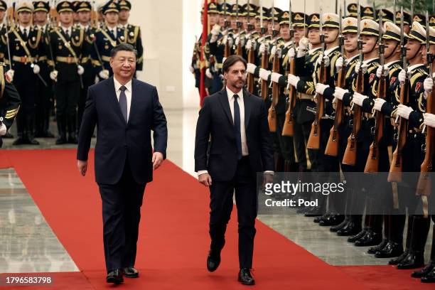 Chinese President Xi Jinping and Uruguay President Luis Lacalle Pou review the honour guard during a welcome ceremony at The Great Hall of the People...