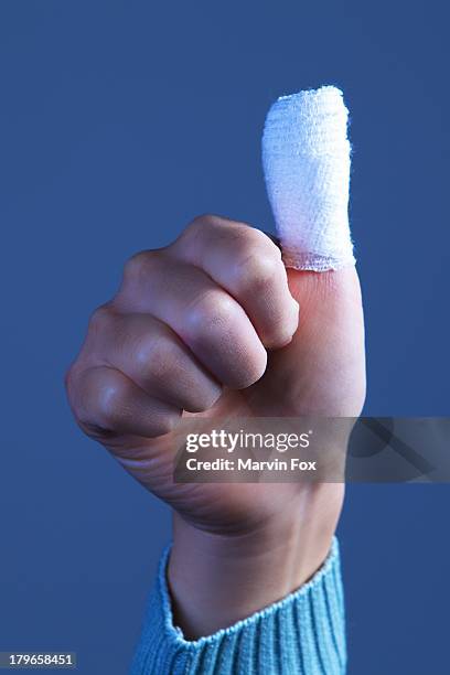 thumbkin - bandaged thumb stock pictures, royalty-free photos & images