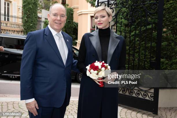 Princess Charlene of Monaco and Prince Albert II of Monaco attend the Red Cross Gifts Distribution on November 16, 2023 in Monaco, Monaco.