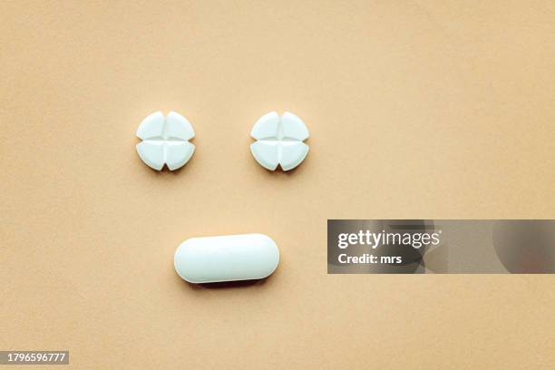 pill face - painkiller stock pictures, royalty-free photos & images