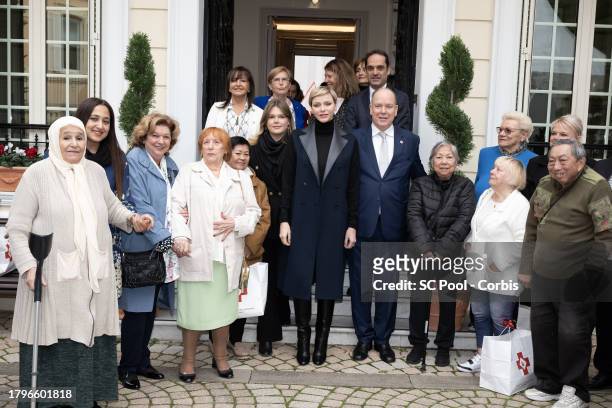 Camille Gottlieb, Princess Charlene of Monaco and Prince Albert II of Monaco attend the Red Cross Gifts Distribution at Monaco Palace on November 16,...