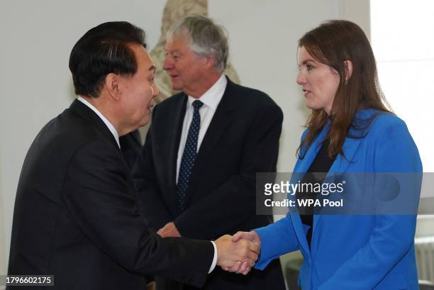 South Korea's President Yoon Suk Yeol shakes hands with Britain's Secretary of State for Science, Innovation and Technology Michelle Donelan at the...