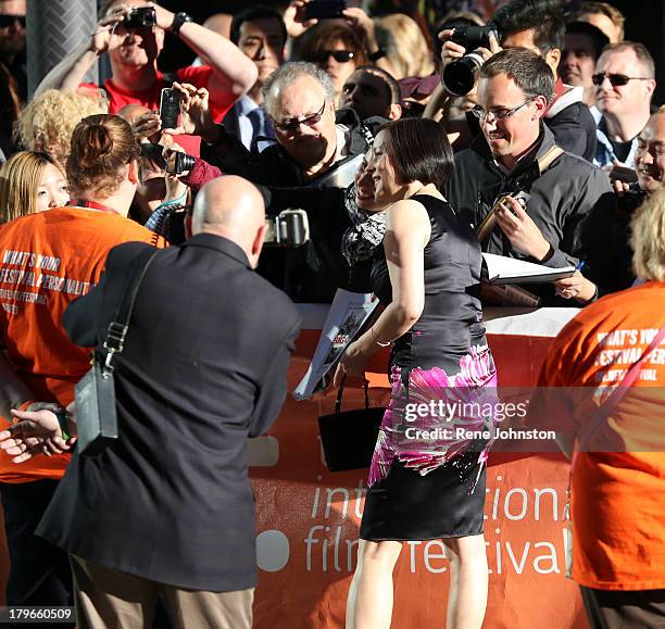 Actress Meg Tilly signs autographs upon arrival at 'The Big Chill' 30th Anniversary screening during the 2013 Toronto International Film Festival at...