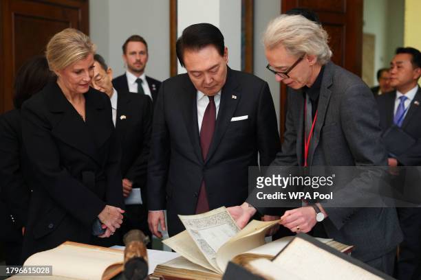 Head of Library at The Royal Society, Keith Moore , shows an artifact to South Korea's President Yoon Suk Yeol and Britain's Sophie, Duchess of...