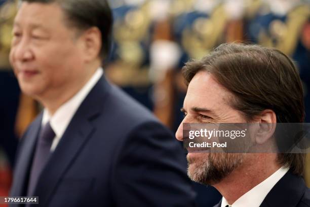 Chinese President Xi Jinping and Uruguay President Luis Lacalle Pou attend a welcome ceremony at The Great Hall of the People on November 22, 2023 in...