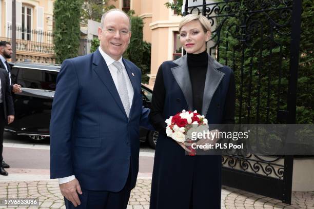 Prince Albert II of Monaco and Princess Charlene of Monaco attend the Red Cross Christmas Gifts Distribution at Monaco Palace on November 16, 2023 in...