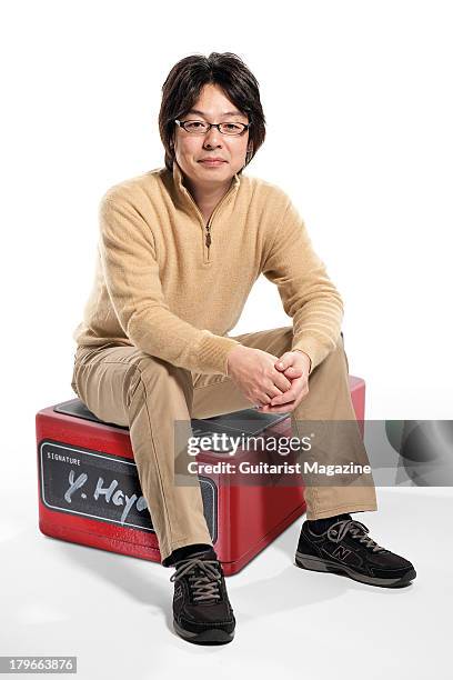 Yukihiro Hayashi, music systems designer and owner of Free The Tone effects pedal company, photographed with an oversized guitar pedal, on December...