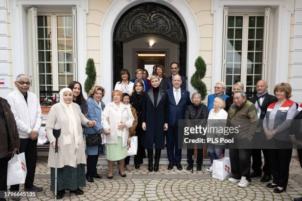Camille Gottlieb, Princess Charlene of Monaco and Prince Albert II of Monaco attend the Red Cross Christmas Gifts Distribution at Monaco Palace on...