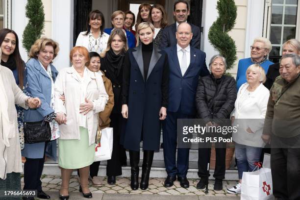 Camille Gottlieb, Princess Charlene of Monaco and Prince Albert II of Monaco attend the Red Cross Christmas Gifts Distribution at Monaco Palace on...