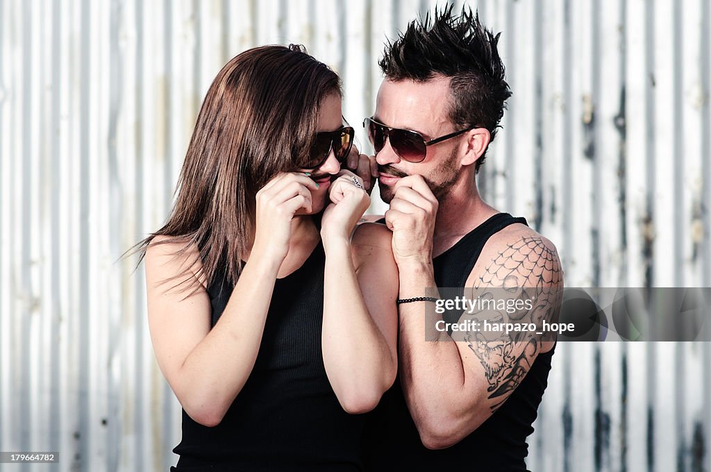 Couple making pretend mustaches