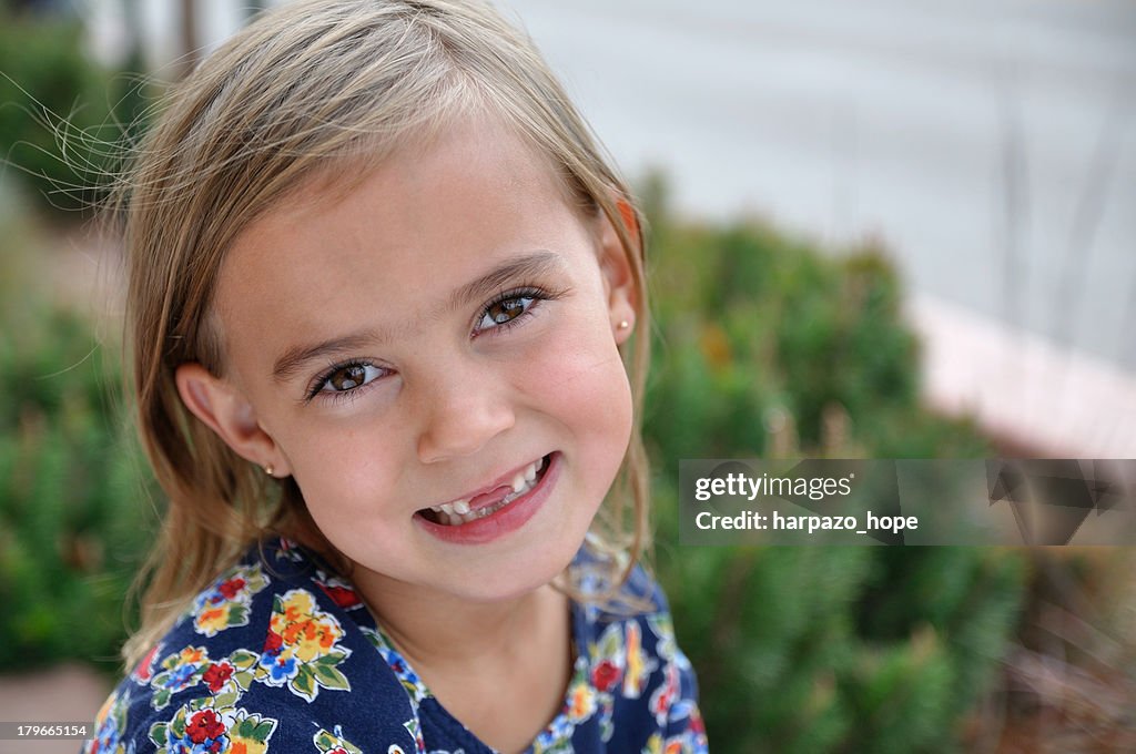 Girl with missing front teeth