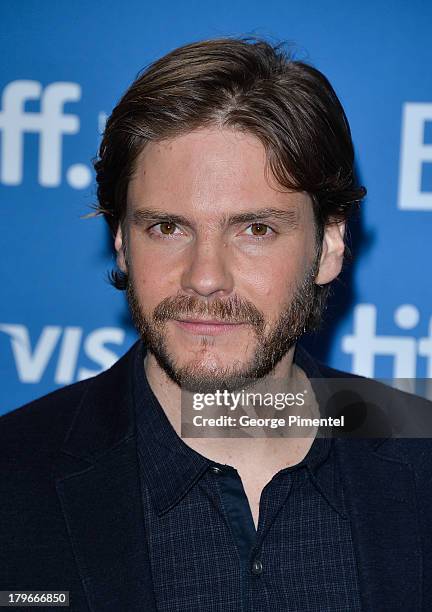 Actor Daniel Bruhl speaks onstage at "The Fifth Estate" Press Conference during the 2013 Toronto International Film Festival at TIFF Bell Lightbox on...