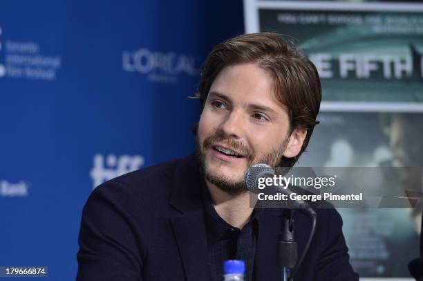 Actor Daniel Bruhl speaks onstage at "The Fifth Estate" Press Conference during the 2013 Toronto International Film Festival at TIFF Bell Lightbox on...