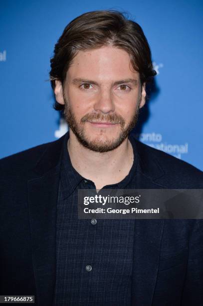 Actor Daniel Bruhl speaks onstage at "The Fifth Estate" Press Conference during the 2013 Toronto International Film Festival at TIFF Bell Lightbox on...