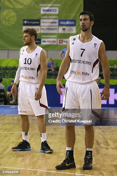 Lucca Staiger and Philip Zwiener of Gemany look thoughtful during the FIBA European Championships 2013 first round group A match between Germany and...