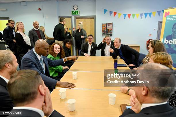 Alex Williams, Mayor of Greater Manchester, Andy Burnham and Prince William, Prince of Wales laugh at a joke at the Hideaway Youth Project, lead...