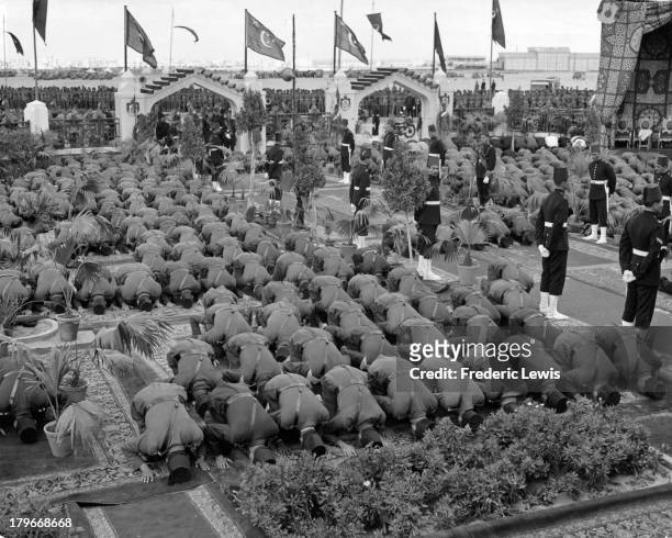 Soldiers attending services at a Mosque with King Farouk in Cairo, Egypt.