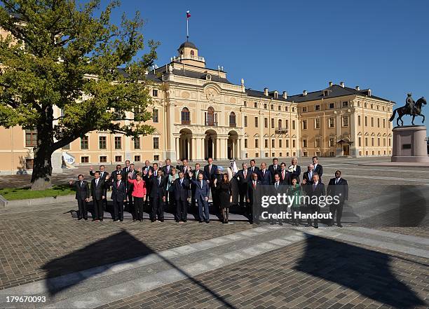 In this handout image provided by Host Photo Agency, : Chair of the Financial Stability Board Mark Carney, Secretary-General of the Organisation for...